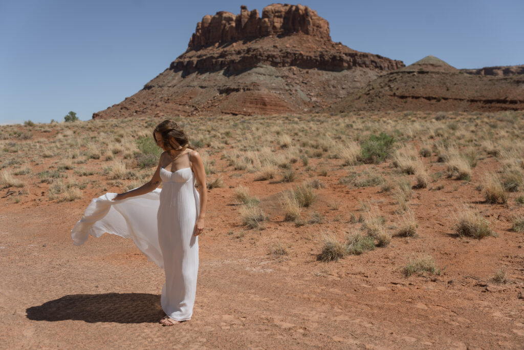 bride dress blowing in the wind in Moab